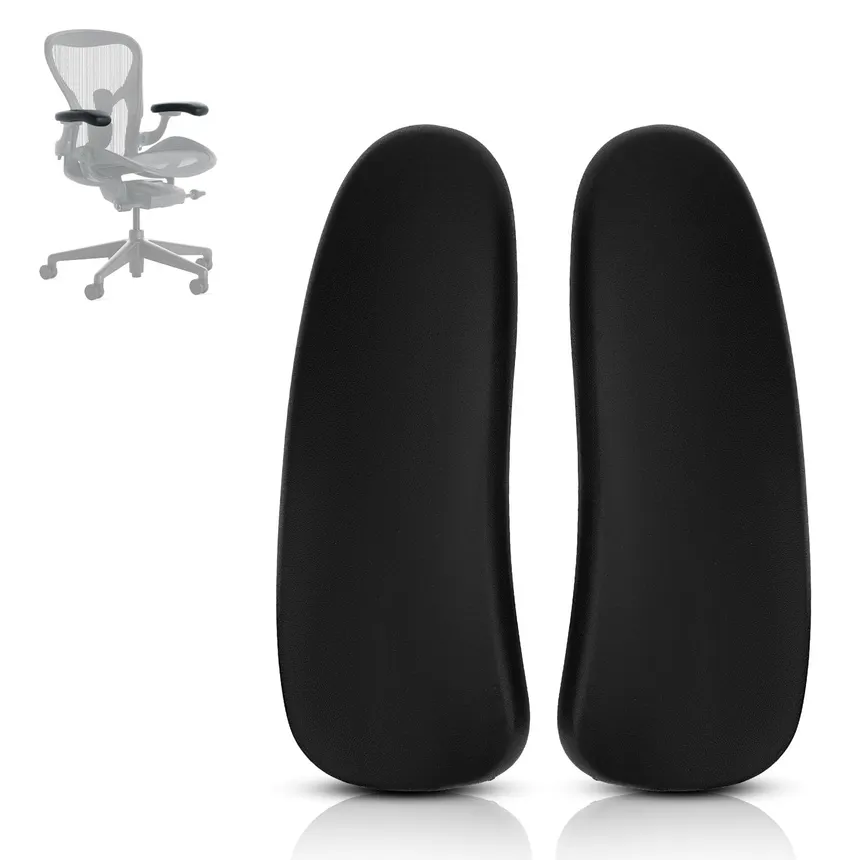 A pair of black office chair armrest pads.